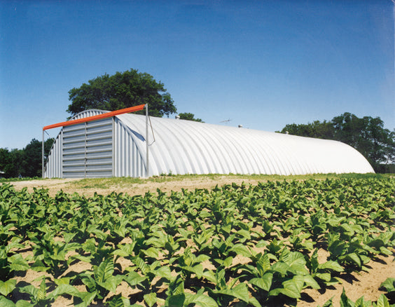 Agricultural Steel Arch Quonset Building with Sliding Barn Doors on a Farm