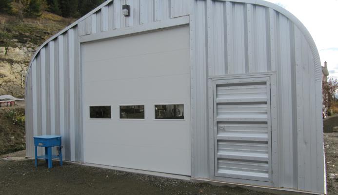 E-Series Steel Arch Quonset Building with Garage Overhead Door